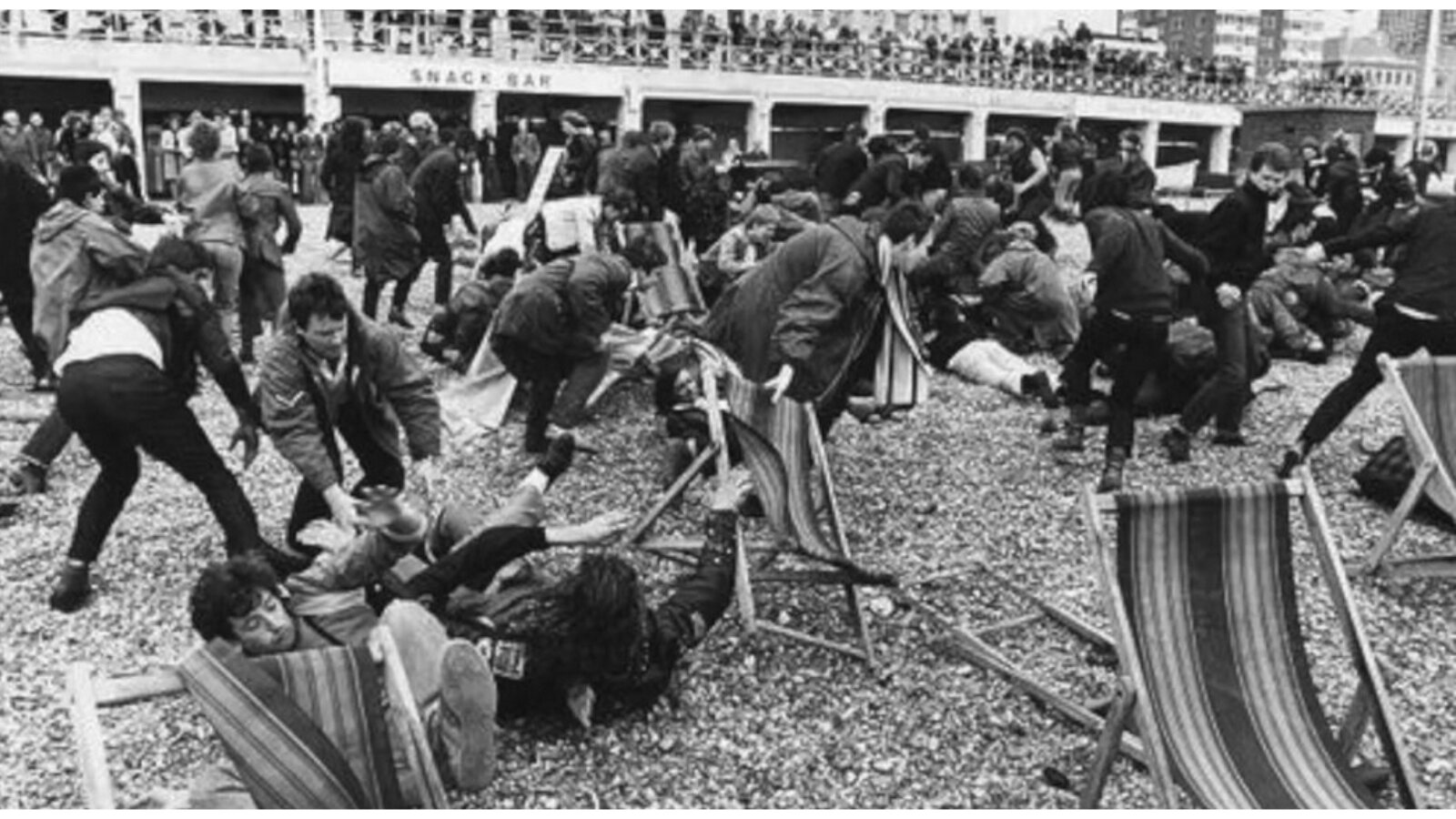 Young people and police on Brighton seafront in 1964